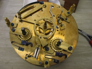 Guilmet Mystery Clock internal workings under dial