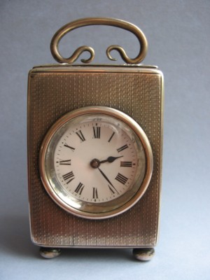 small silver-cased carriage clock
